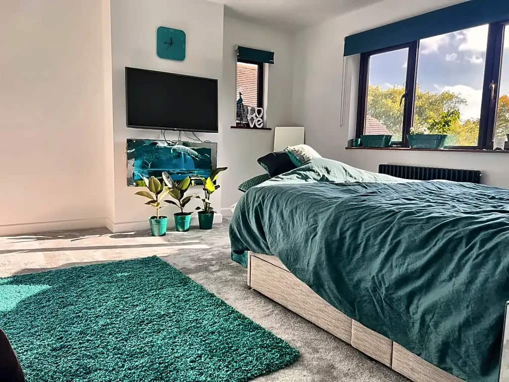 Loft bedroom with a garden view